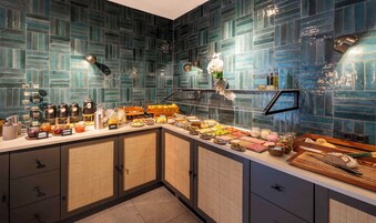 A breakfast buffet with a variety of food items and condiments.