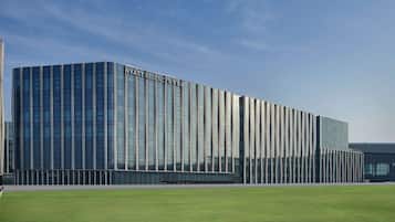 Stylish building with a rhythmic facade, situated in a well-maintained urban area.