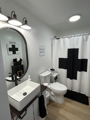 Combined shower/tub, hair dryer, towels, soap