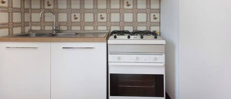 Fridge, stovetop, coffee/tea maker, cookware/dishes/utensils