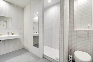 Bathtub, hair dryer, towels