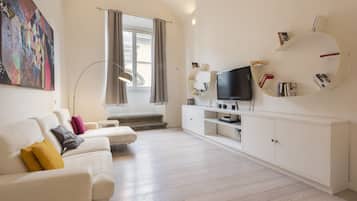 Luxury Apartment | Living area | 40-inch flat-screen TV with digital channels, TV