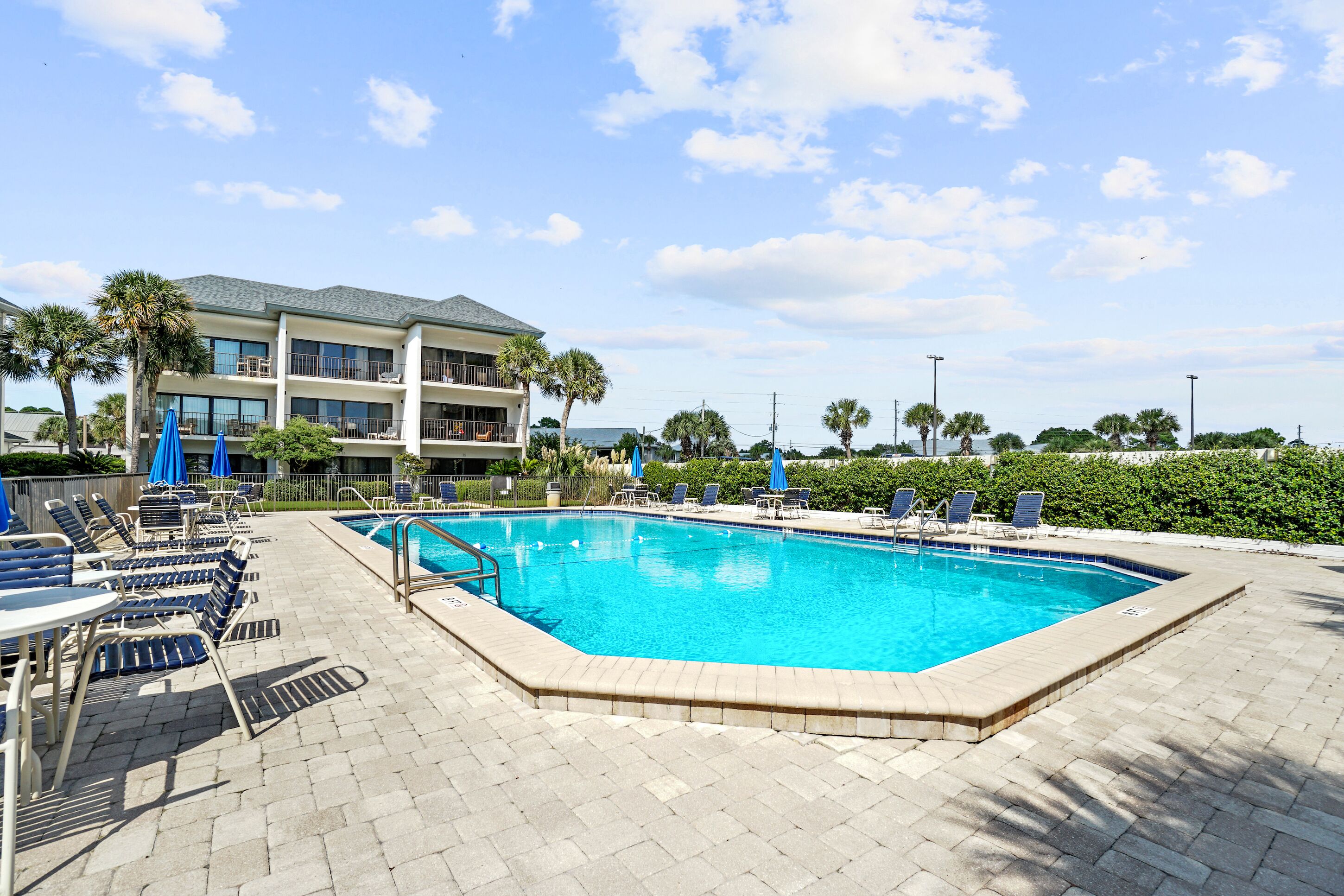 Seasonal outdoor pool, pool umbrellas, pool loungers