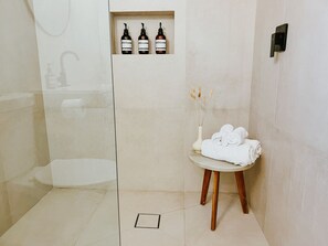 Bathtub, hair dryer, towels, soap
