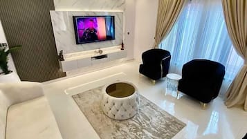 Apartment | Living area | 25-inch Smart TV with cable channels, TV