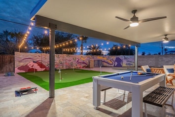 Play some pool, cornhole or golf in the backyard.