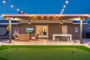 A covered patio with artificial lighting, a pool table, and outdoor seating. - Pool & Art Lover Oasis near Old Town w/ Mini Golf (Scottsdale)