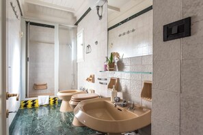 A bathroom with two sinks, a shower, and a toilet. - Ricasoli Apartment - Two Bedroom Apartment, Sleeps 4 (Firenze)