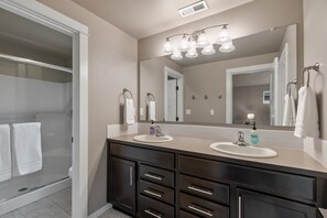 Shower, hair dryer, towels, soap