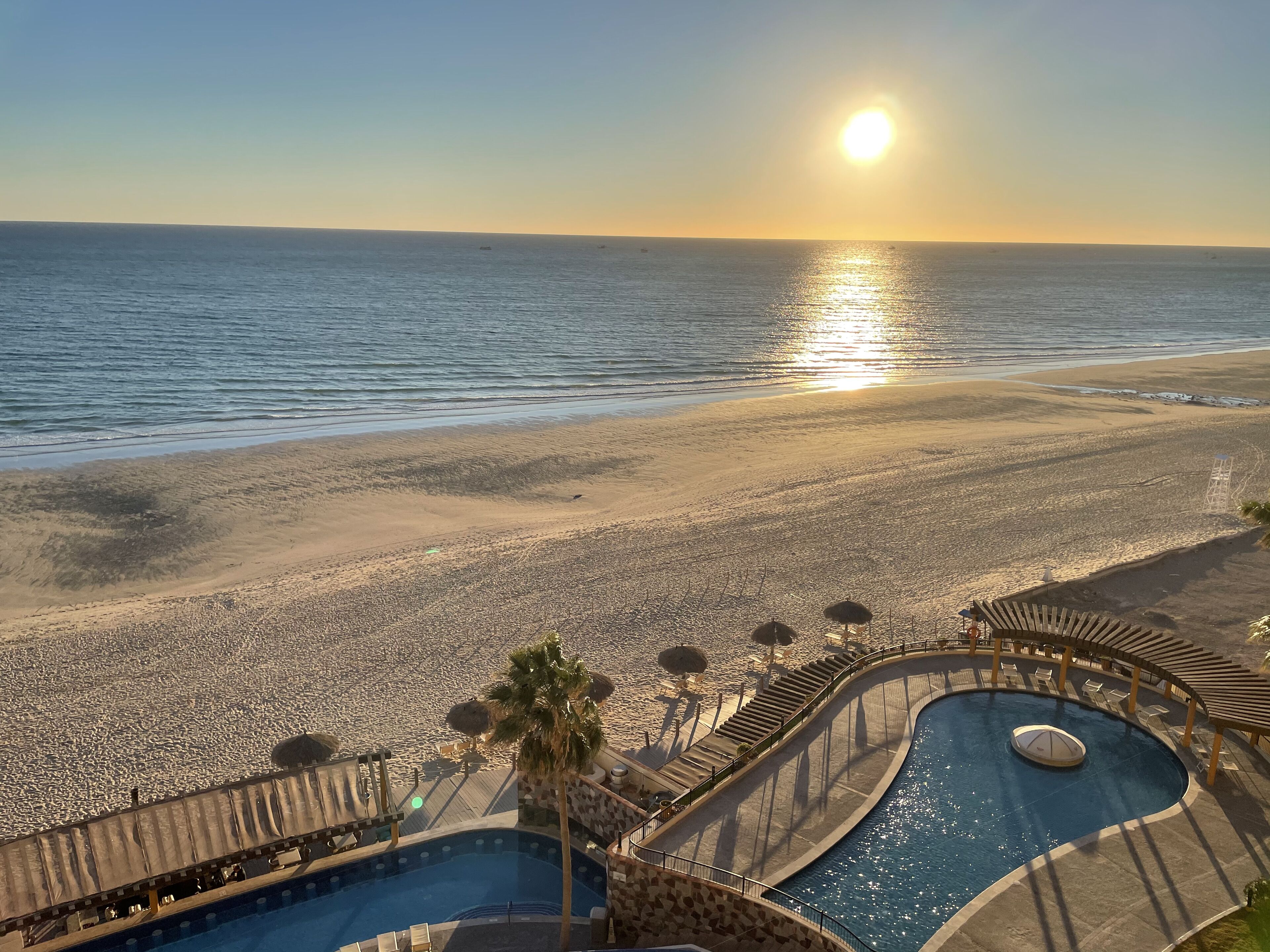 On the beach, sun loungers, beach towels
