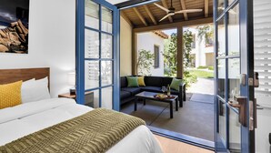 A bedroom with a bed, a sofa, and a dining table. - Fabulous King 2BR/2BA/2Car Legacy Villa near Pool (La Quinta)