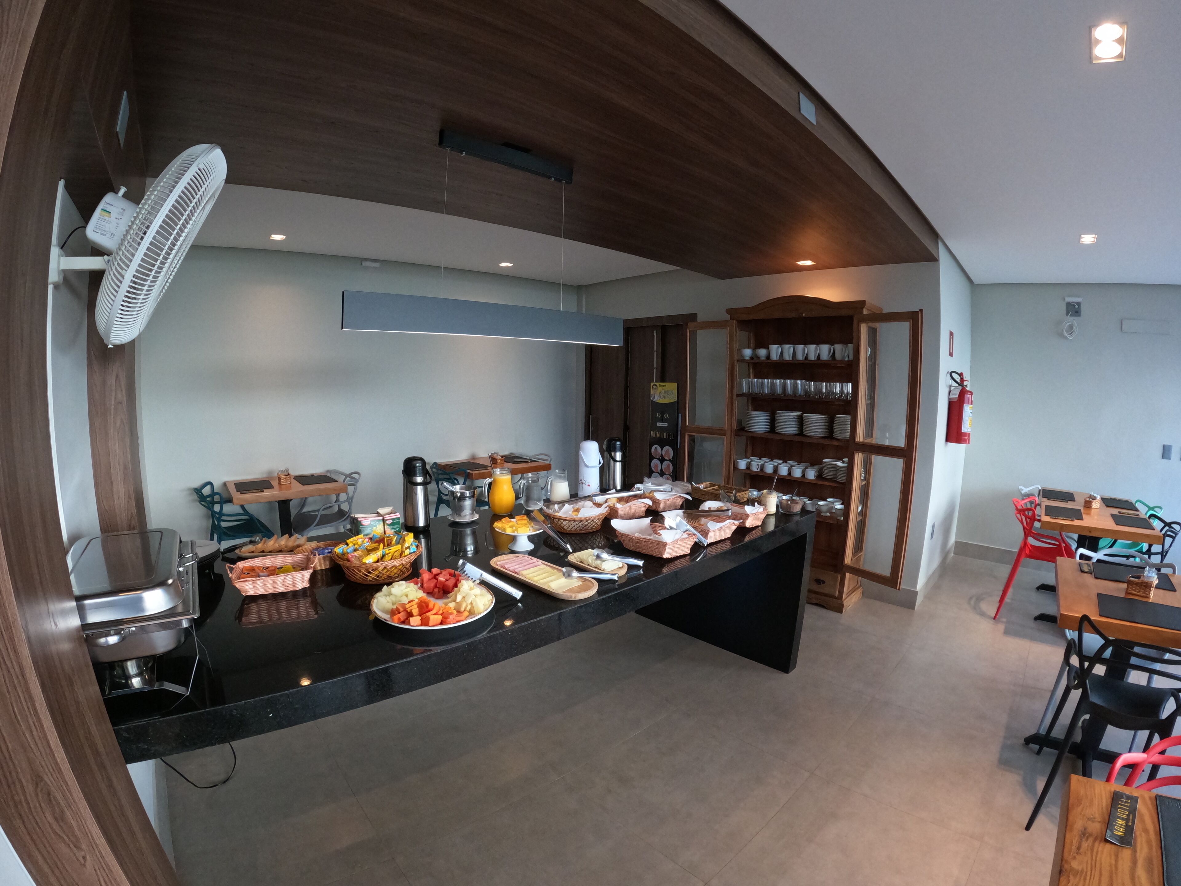 A buffet setup with various food items and a coffee station.