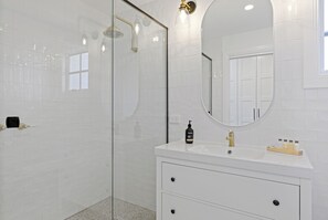 Bathtub, hair dryer, towels, soap