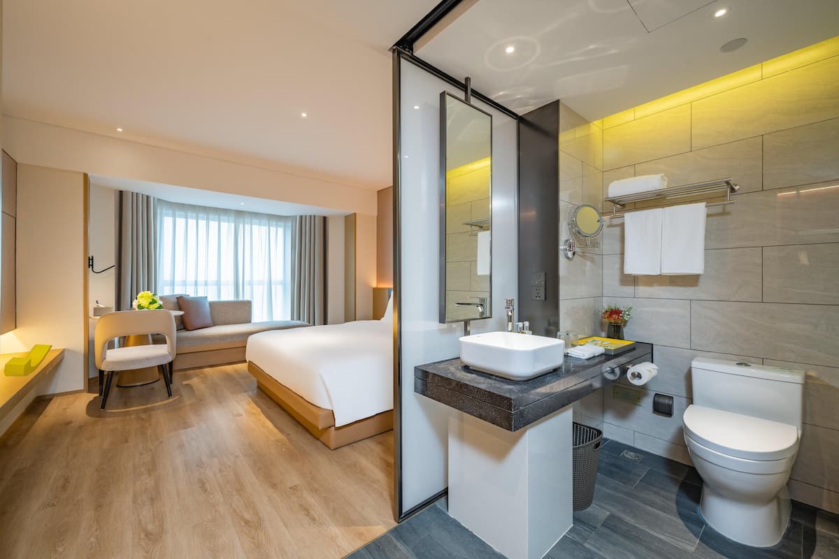Bathroom | Rainfall showerhead, designer toiletries, hair dryer, slippers