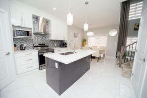 Fridge, microwave, oven, stovetop - Entire Luxury 4-Bedroom Home with Indoor Fireplace- Near YEG Airport (Beaumont)
