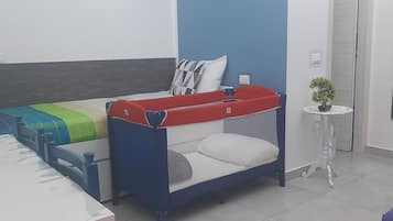 Family Quadruple Room, Non Smoking | Down comforters, in-room safe, desk, laptop workspace