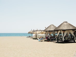 On the beach, sun-loungers, beach towels