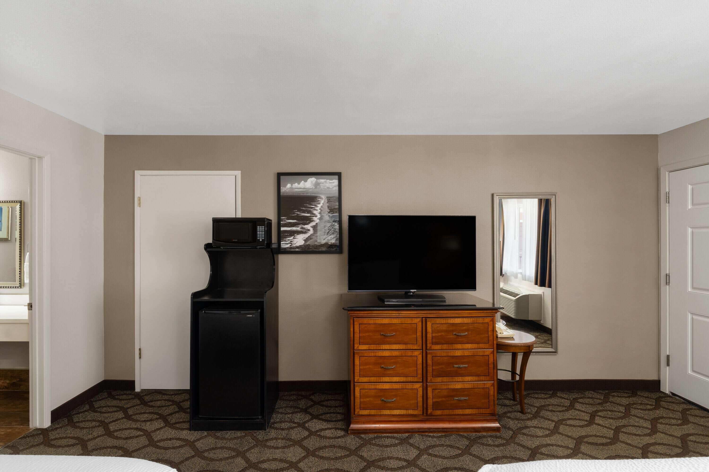 Premium bedding, pillow-top beds, desk, laptop workspace