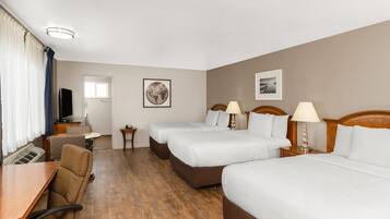 Premium bedding, pillow-top beds, desk, laptop workspace