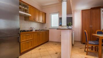Family Apartment A2 | Private kitchen | Fridge, microwave, stovetop, toaster