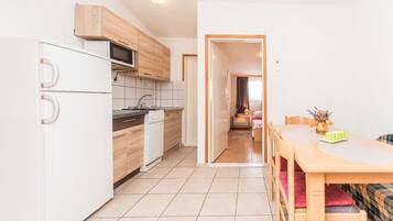 Family Apartment A1 | Private kitchen | Fridge, microwave, stovetop, toaster
