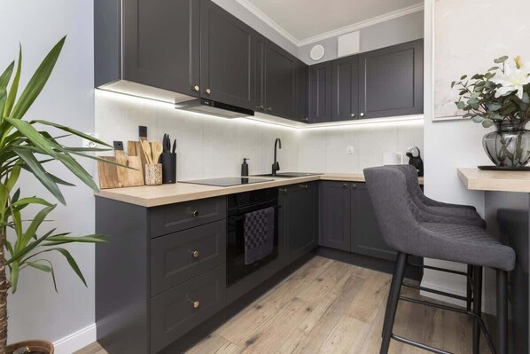 Enjoy cooking in this well-equipped kitchen with an oven and sink.