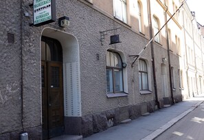 A building with a sign indicating a professional locksmith service.