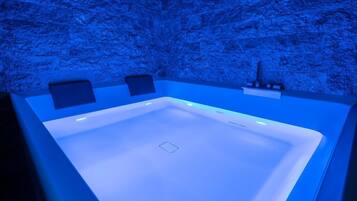 Relax in a sleek, modern bathtub, perfectly suited for a calming soak.