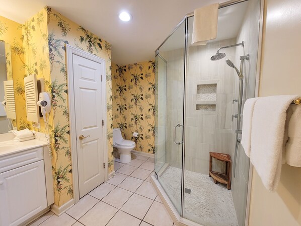 A bathroom with a shower, toilet, and vanity. - Direct oceanfront, 4 bedroom, 3 bath condo - Margate Tower 207 (Myrtle Beach)