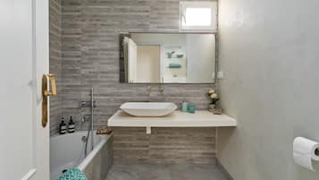 Bathtub, hair dryer, towels