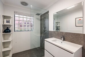 Shower, towels, soap, toilet paper