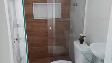 Shower, towels, soap, toilet paper
