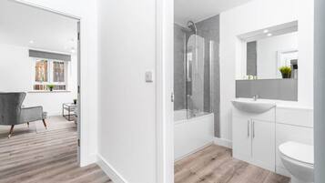 Shower, hair dryer, towels, soap