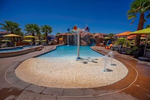 A pool area with multiple water features, including a central fountain and a water slide. - Arcadia 45 | Dog Friendly! Private Hot Tub * Sleeps 22 * Arcade * (Santa Clara)
