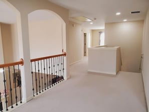 Stunning hallway leading to a welcoming reception area with a large desk.