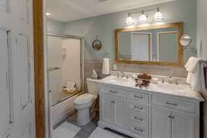 Bathtub, hair dryer, towels, soap