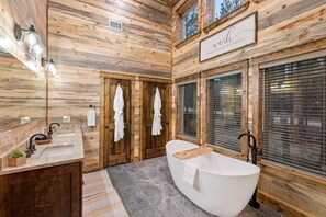 Bathtub, hair dryer, towels, soap