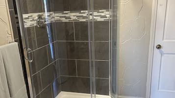 Shower, towels, soap, toilet paper