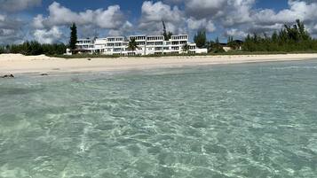 On the beach, sun loungers, beach towels