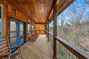 Step out onto the deck and enjoy the serene forest views.
