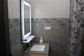 Shower, towels, soap, toilet paper