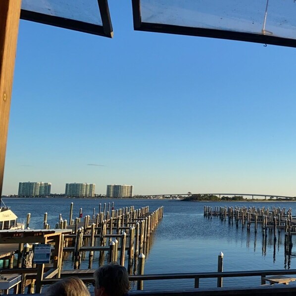 Enjoy waterfront views from this outdoor seating area overlooking the marina and city skyline.
