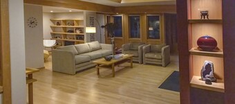 Mid-Century Modern Retreat on Private 10 Acres with 1-Acre Pond & Nature Trails.