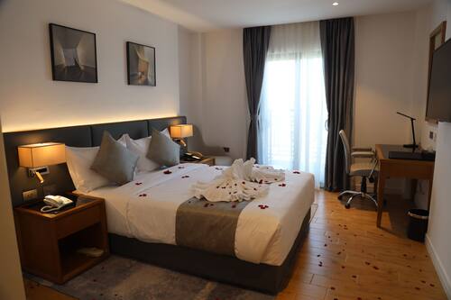 Deluxe Room | In-room safe, desk, laptop workspace, iron/ironing board
