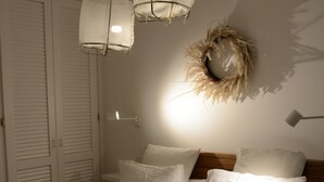 A neatly made bed with white linens, a wooden headboard, and two hanging pendant lights. - Cap D'Antibes sea, swimming pool, 2 large terraces, nature and pines (Antibes)