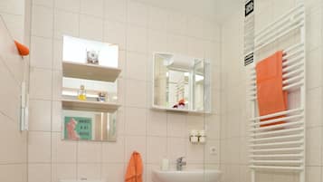 Shower, hair dryer, towels, toilet paper