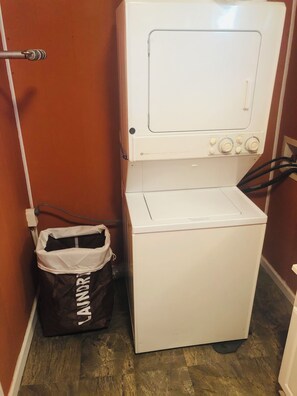 Convenient laundry facilities include a front-loading washing machine.
