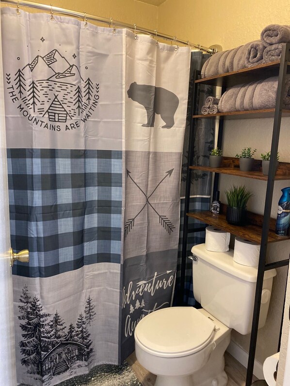 Combined shower/tub, hair dryer, towels, soap