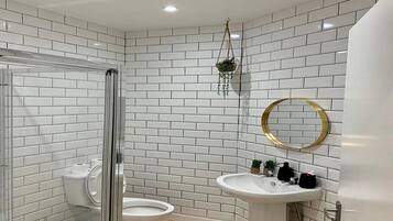 Shower, rainfall showerhead, towels, soap