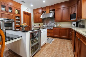 Enjoy cooking in this well-equipped kitchen with a stove, oven, and microwave.